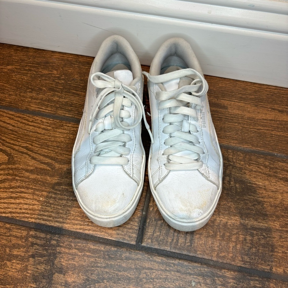 Woman’s White Pumas